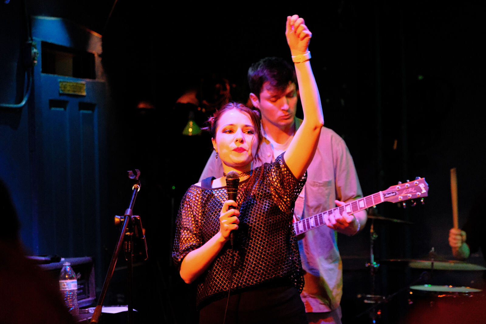 Midwest Honey's singer with a fist raised mid-song